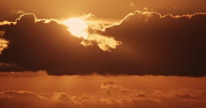 4K sunset dusk twilight sundown timelapse dark clouds sky. Fast motion showing vibrant orange and red hues illuminating dramatic evening horizon - Powered by Adobe