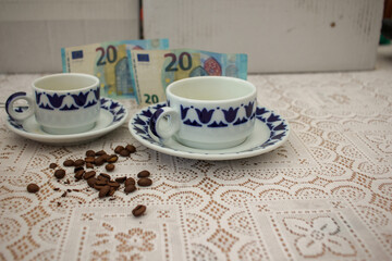 cups of coffee and twenty euro bills on the table