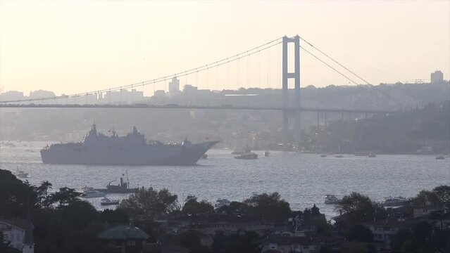 TCG Anadolu passes under Bosphorus Bridge for 100th anniversary on Oct 29, 2023.