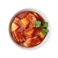 Delicious goulash in bowl isolated on white, top view