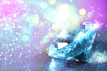 Beautiful diamond on shiny glitter, bokeh effect. Space for text