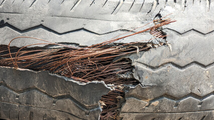 badly damaged car tires, used car tires. old worn damaged tires