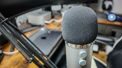 Microphone in Foreground with Computer Equipment in the Background
