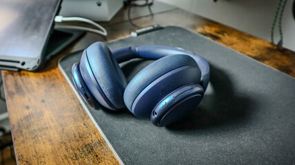 Wireless Blue Headphones on a Desk - Modern Audio Gear