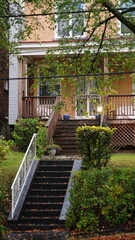 The apartments view with the warm sunlight and colorful trees in autumn
