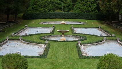 The beautiful garden view with the green trees and grass in it
