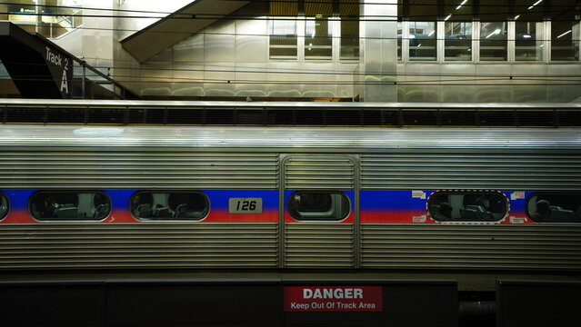 The railroad view with the parallel iron tracks and platform as background
