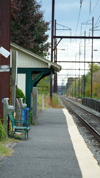 The railroad view with the parallel iron tracks and platform as background
