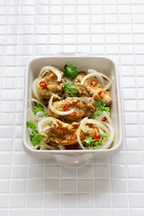 Oyster escabeche, battered and fried oysters marinated with vinegar sauce.