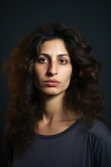 Gorgeous israeli young woman looking at the camera on gray background