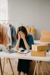 Fashion blogger concept. Young Asian women selling clothes on video streaming.Startup small...