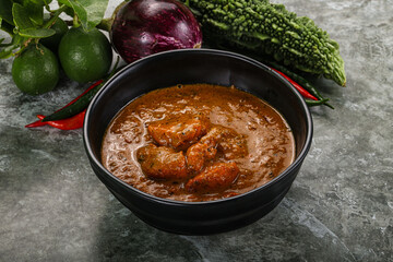 Indian cuisine - chicken curry with spices