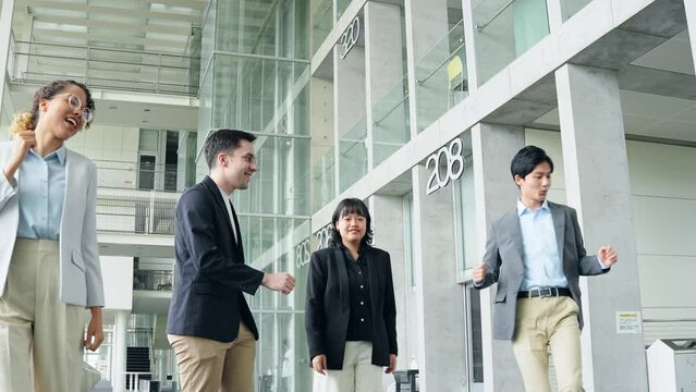 Multinational business group dancing in lobby. Success of business.
