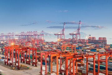 shanghai container port in sunset - obrazy, fototapety, plakaty