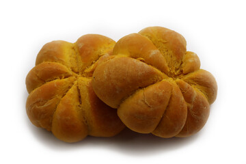 Bright orange pumpkin shaped bread buns isolated on white background