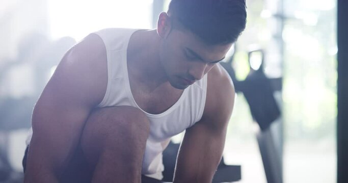 Man, tie or shoes for workout, fitness or exercise with determination and getting ready at gymnasium. Person, face or athlete tying laces with sportswear and resilience for physical activity or body
