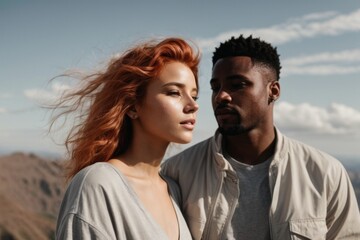 Close-up portrait of a beautiful couple in nature. Black man and Caucasian woman on a date, hiking, love, valentine's day concepts.