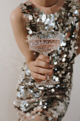 Luxury Christmas, New Year, Birthday holiday party celebration concept. Young woman holding glass...