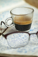 espresso coffee on an old manuscript