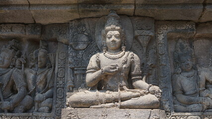 Fototapeta na wymiar Wall sculpture around Prambanan the largest majestic Hindu stone temple in Indonesia