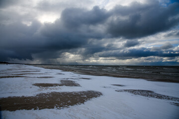 Snowy storm by Baltic sea.