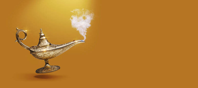 Golden magic lamp on gold background