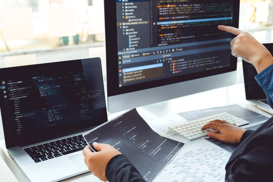 Developing programmer Team Development Website design and coding technologies working in software company office