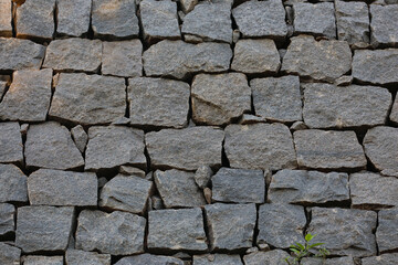 black stone wall background - construction concept