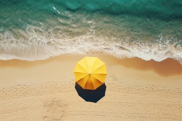 Obraz premium Aerial view of sandy beach with umbrella and blue water. Generative AI