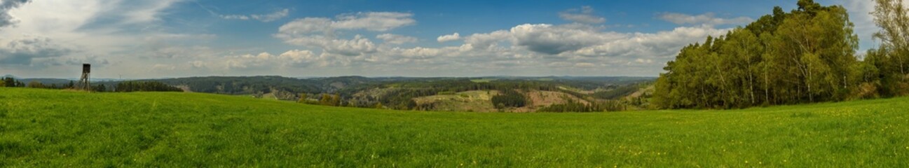 Obraz premium panorama of country side with meadow, high seat and forest