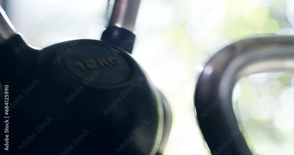 Wall mural Sports, kettlebell and closeup of man athlete in the gym for strength training, exercise or workout. Fitness, health and zoom of male person hands with weights for body wellness challenge in a center