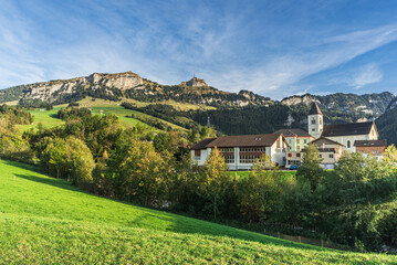 The village of Bruelisau with the Catholic church, behind the Alpstein mountains with Hoher Kasten and Kamor, Canton Appenzell Innerrhoden, Switzerland