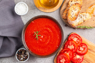 Tomato soup or sauce with rosemary.  Healthy, vegan and dieting lunch and dinner concept. Gazpacho. 
