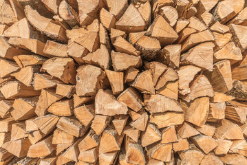 Wood logs, pile of chopped and stacked fire wood
