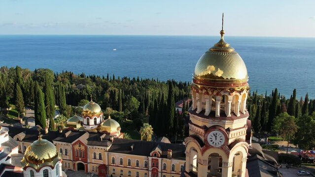 New Athos Monastery in Abkhazia, the city of New Athos, drone footage, autumn green hills 