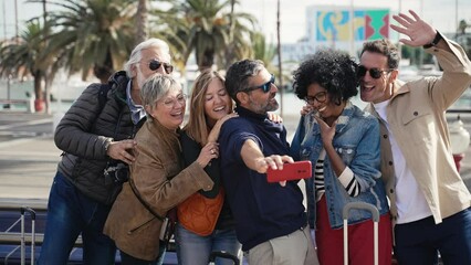 Family friends taking a selfie picture with cell phone during weekend leisure trip
