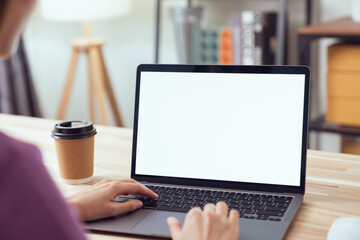 Woman hand type on the keyboard on laptop with mockup of blank screen for the application. - obrazy, fototapety, plakaty