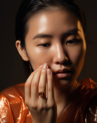 Portret azjatyckiej dziewczyny dotykającej palcami twarzy - subtelna kobiecość - Portrait of an Asian girl touching her face with her fingers - subtle femininity - AI Generated - obrazy, fototapety, plakaty