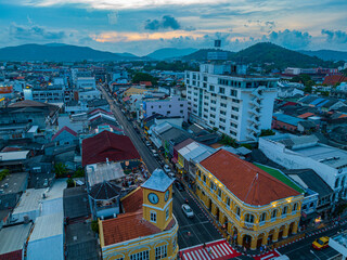 .Phuket,Thailand-April,19,2023: An aerial view of Phuket's most popular historical landmarks..clock tower the classic and beautiful architecture at Charter intersection. .popular landmark in Phuket.