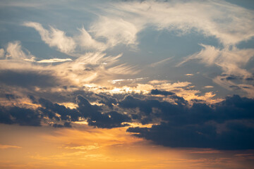 Orange sunrise on the horizon with emphasis on the sun's rays and birds in the distance. Idyllic Setting
