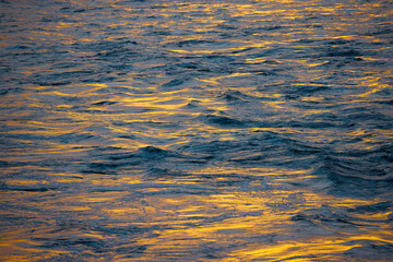 Waves on the flooded Rhône at sunset
