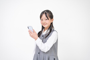 Fototapeta premium 携帯を持つ若い女性