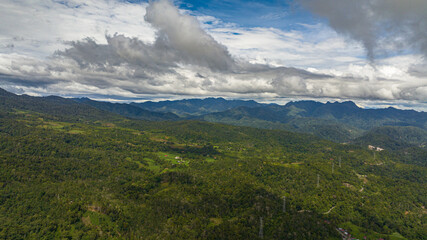 Aerial view of mountains with rainforest and clouds. Sumatra, Indonesia.