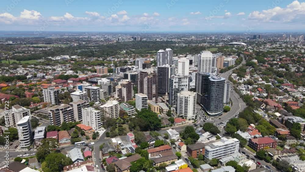 Wall mural Aerial drone rotation view of Bondi Junction in the Eastern Suburbs of Sydney, NSW Australia with Sydney City in the background on a sunny day