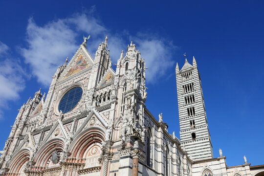 Facade of Cathedral of SIENA in Italy and Bell Tower