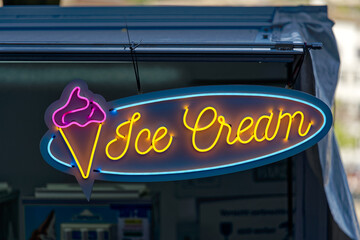 Neon light with text ice cram at market stall at fair named Züri Fäscht at City of Zürich on a...