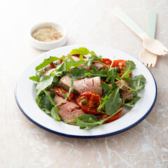 Arugula salad with roast beef and tomatoes