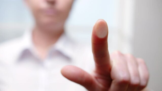 Human hand fingerprint on glass surface. Fingerprint scanning, biometric personal identification, access control.