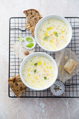 Warming cheesy soup with truffle oil
