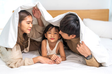 Portrait of enjoy happy love asian family father and mother holding hug cute little asian girl child smiling play and having fun moments good time, care, kid, support, insurance, child, at home